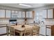 Bright eat-in kitchen boasts ample cabinet space, modern appliances, and a charming breakfast nook at 3121 Natoma Way, Orlando, FL 32825