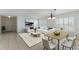 Inviting living room and dining area showcasing tile floors, plantation shutters, and a modern design at 3121 Natoma Way, Orlando, FL 32825