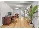 Bright office with a wooden desk, hardwood floors, and a cozy atmosphere, perfect for productive work from home at 330 N Stone St, Deland, FL 32720