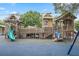 Community playground featuring multiple play structures with slides, swings, and climbing apparatus at 330 N Stone St, Deland, FL 32720