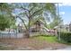 Community playground with climbing structures, slides, and a secure fenced perimeter at 330 N Stone St, Deland, FL 32720