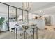 Charming dining area with a modern chandelier, stylish furniture, and open layout at 345 Goldstone Pl, Lake Mary, FL 32746