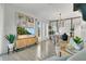 Bright living room with modern decor, a large television, and an open floor plan at 345 Goldstone Pl, Lake Mary, FL 32746