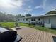 Backyard deck features a grill and seating space for outdoor entertaining at 3702 Mirror Lake Dr, Apopka, FL 32703