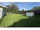 Expansive backyard offers ample green space and outdoor storage at 3702 Mirror Lake Dr, Apopka, FL 32703