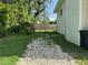 Fenced in backyard with gravel area and well maintained lawn at 3702 Mirror Lake Dr, Apopka, FL 32703