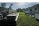 Backyard featuring a wooden deck with outdoor furniture and green grass at 3702 Mirror Lake Dr, Apopka, FL 32703