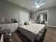 Bright bedroom with hardwood floors, ample storage, and a mirrored closet at 3702 Mirror Lake Dr, Apopka, FL 32703