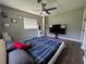 Comfortable bedroom with hardwood floors, a modern bed frame, and plenty of space for relaxation at 3702 Mirror Lake Dr, Apopka, FL 32703