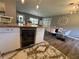 Cozy dining area open to the kitchen, showcasing modern furnishings and a stylish built-in beverage cooler at 3702 Mirror Lake Dr, Apopka, FL 32703