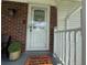 Welcoming entryway with seasonal wreath, stylish accents and brick accents creating a warm first impression at 3702 Mirror Lake Dr, Apopka, FL 32703