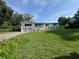 Charming two-story home with white siding, well-manicured lawn, and attached two-car garage at 3702 Mirror Lake Dr, Apopka, FL 32703