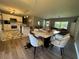 Open concept design with kitchen, dining, and living area, creating a spacious and inviting atmosphere at 3702 Mirror Lake Dr, Apopka, FL 32703