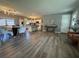 Open concept living space featuring kitchen, dining, and living areas, perfect for modern living and entertaining at 3702 Mirror Lake Dr, Apopka, FL 32703