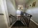 Stairway to basement features safety gate and decor at 3702 Mirror Lake Dr, Apopka, FL 32703