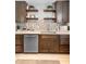 Kitchen bar area with stylish mosaic tile, floating shelves, and lots of counter space at 3824 Johnson St, Orlando, FL 32805