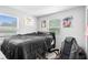 Relaxing bedroom with a comfortable queen-sized bed and bright natural light from dual windows at 3824 Johnson St, Orlando, FL 32805