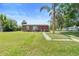 Cozy single-story home with a well-manicured lawn and inviting front entrance at 3824 Johnson St, Orlando, FL 32805