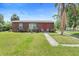 Charming single-story home with a well-maintained lawn and inviting front porch area at 3824 Johnson St, Orlando, FL 32805
