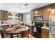 Charming bar area with tiled backsplash, white countertops, and wood cabinets at 3824 Johnson St, Orlando, FL 32805