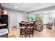 Open concept dining and living area with wood-look floors and plenty of space to relax at 3824 Johnson St, Orlando, FL 32805