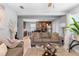 Comfortable living room showcasing neutral tones, wood-look floors and connecting to the kitchen at 3824 Johnson St, Orlando, FL 32805