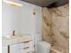 This modern bathroom features a marble vanity, gold fixtures, and a walk-in shower with elegant detailing at 400 E Colonial Dr # 1103, Orlando, FL 32803