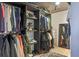 This walk-in closet offers ample storage with shelves, rods, and a mirrored corner in a well-lit space at 400 E Colonial Dr # 1103, Orlando, FL 32803