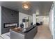 This modern living room features a fireplace, dark ceilings, and an open layout for seamless entertaining at 400 E Colonial Dr # 1103, Orlando, FL 32803