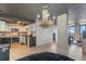 Spacious living room with open-concept kitchen, herringbone floors, and modern finishes, perfect for entertaining at 400 E Colonial Dr # 1103, Orlando, FL 32803