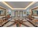 Elegant lobby with stylish seating, a starburst tile floor, and elevator access for a welcoming first impression at 400 E Colonial Dr # 1103, Orlando, FL 32803