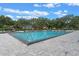 A beautiful community pool surrounded by lounge chairs and lush landscaping offers residents a relaxing oasis at 400 E Colonial Dr # 1103, Orlando, FL 32803