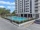 Aerial view of the building's pool, complemented by sleek architecture and ample seating at 400 E Colonial Dr # 1103, Orlando, FL 32803