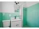 Retro bathroom with green tile and shower at 418 Tulane Dr, Altamonte Springs, FL 32714