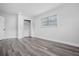 Bedroom with gray floors, a closet with bi-fold doors, and a window providing natural light at 418 Tulane Dr, Altamonte Springs, FL 32714