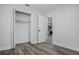Open closet with hanging racks and a view to the kitchen at 418 Tulane Dr, Altamonte Springs, FL 32714