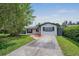 Home exterior showing the well-maintained lawn and long driveway at 418 Tulane Dr, Altamonte Springs, FL 32714