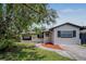 Charming single-story home with a well-maintained lawn and a inviting walkway at 418 Tulane Dr, Altamonte Springs, FL 32714