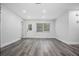 Living room featuring a white door and trim, plus large windows at 418 Tulane Dr, Altamonte Springs, FL 32714
