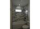 This bathroom features marble tile in the shower at 508 Bennett St, Auburndale, FL 33823