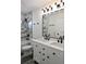 This bathroom features double sinks and a marble-tiled shower at 508 Bennett St, Auburndale, FL 33823