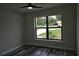 This bedroom has a large window with modern flooring at 508 Bennett St, Auburndale, FL 33823