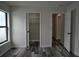 Bedroom showing wood-look flooring, a closet, and a window with a view of the side yard at 508 Bennett St, Auburndale, FL 33823