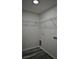 This walk-in closet features wire shelving and modern floors at 508 Bennett St, Auburndale, FL 33823