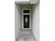 This is a covered entrance with a decorative front door at 508 Bennett St, Auburndale, FL 33823