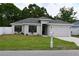 Charming single-story home with a well-manicured lawn, attached garage, and cozy curb appeal at 508 Bennett St, Auburndale, FL 33823