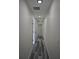 Hallway featuring wood-look flooring, recessed lighting, and doors leading to various rooms at 508 Bennett St, Auburndale, FL 33823