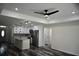 Open living room with a view into the kitchen, features recessed lighting and wood floors at 508 Bennett St, Auburndale, FL 33823