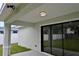 This covered patio has a ceiling light at 508 Bennett St, Auburndale, FL 33823