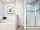 Modern bathroom with tiled shower, soaking tub, and decorative accents at 5255 Wildwood Way, Davenport, FL 33837